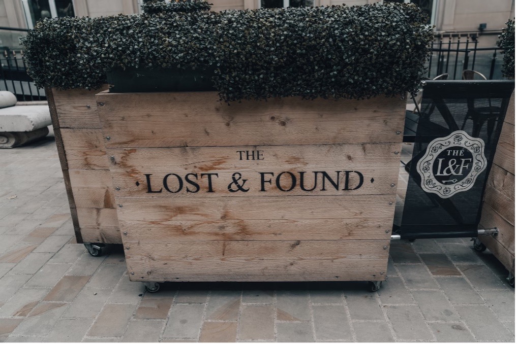 Flower box with the words lost and found printed on it.