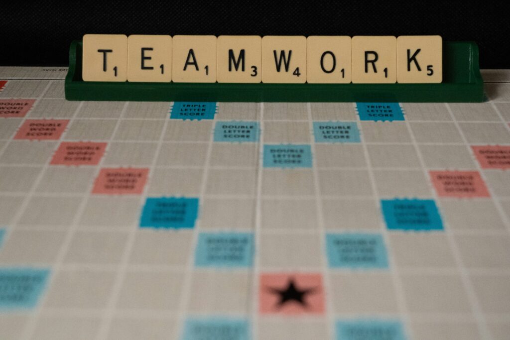 The word Teamwork on a scrabble game board
